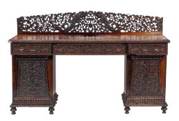 An Anglo-Indian carved and stained hardwood, probably padouk sideboard, 'possibly southern India',