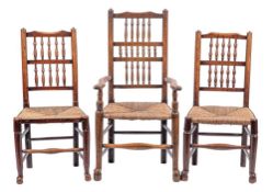 A composed set of eight oak and rush seated spindle back dining chairs, 19th century,