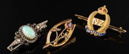 An opal and seed pearl brooch,: the oval cabochon opal within a surround of seed pearls,