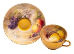 A Royal Worcester fruit painted cup and saucer: painted by William Ricketts with fruit and blossom