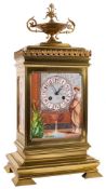 A French gilt-brass and porcelain panelled mantel clock: the eight-day duration movement striking