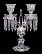 A Baccarat double candlestick: with central spite flanked by two arms supporting wrythen drip pans
