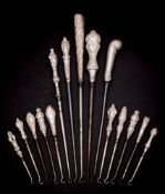 A collection of fifteen assorted silver-handled button hooks,