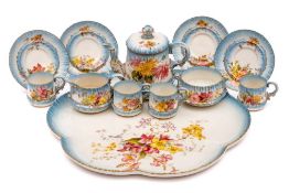 A Royal Worcester porcelain cabaret set: comprising a teapot and cover, sugar bowl, milk jug,