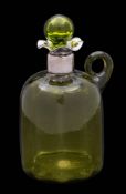 A green glass claret flask: of domed cylindrical form with applied loop handle and hollow globe