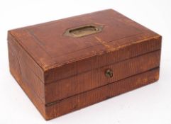 A late Victorian/Edwardian travelling writing slope: of rectangular outline with leather bound