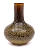 A Chinese 'eel-skin' glazed bottle vase: covered in a speckled glaze on a brown ground,