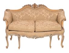 A carved and painted beech and silk damask upholstered sofa in Italian 18th century taste,