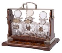 WITHDRAWN Betjeman's patent oak and plate mounted tantalus: containing three clear glass