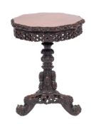 An Anglo Indian carved and stained hardwood circular occasional table, Bombay Presidency,