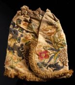 A 17th century silk work coif or biggin: decorated with flowers,