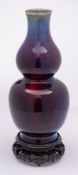 A Chinese flambé double gourd vase: covered with a rich mottled sang-de-boeuf,