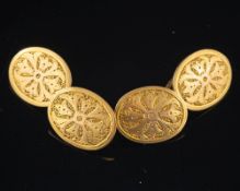 A pair of double sided cufflinks,: the oval panels with engraved detail, stamped 15, 2.2cm long, 6.