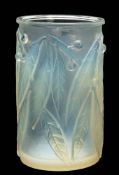 A Lalique vase 'Laurier': of cylindrical form the opalescent exterior moulded with laurel leaves