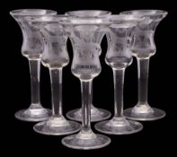 A set of six Dutch wine glasses: the bell shaped bowls engraved with a galloping steed beneath the