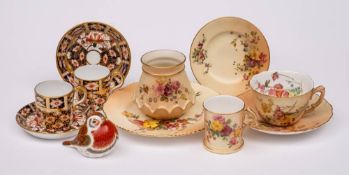 A mixed group of Royal Worcester and Royal Crown Derby porcelain: comprising a blush ivory cup and