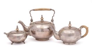 A German white metal three-piece part tea service, bears marks for Marpe, Dresden,