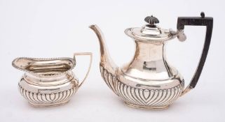 A late Victorian silver coffee pot and cream jug, maker Fordham & Faulkner, Sheffield,
