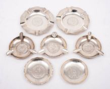 Two Edward VII Chinese silver ashtrays with Straits Settlement coin inserts: and five Chinese