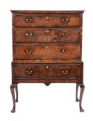 A George II walnut and crossbanded chest on stand, mid 18th century and later,
