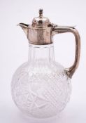 An Edward VII clear glass and silver mounted claret jug, maker W H Lyde, Birmingham,