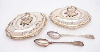 A pair of silver plated entree dishes and covers: of oval outline,