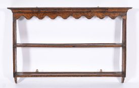 A set of George III oak wall shelves, circa 1770,