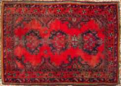 A Turkey Carpet:, of traditional design and colours,
