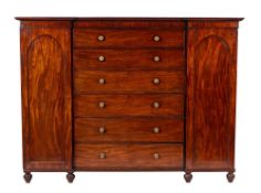 A Regency or George IV mahogany wardrobe with chest, circa 1820,