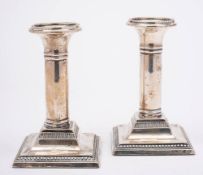 A pair of Edward VII silver desk candlesticks, maker Barker Brothers, Chester,