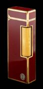 WITHDRAWN Dunhill, Rollagas, a red lacquer lighter,: with red lacquer panels, stamped Dunhill, 6.