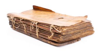HOLY BOOK : hand written in a Coptic script, on heavily stained vellum,