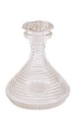 A 19th century ship's decanter: the star cut mushroom stopper over stepped body with wheel engraved