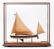 A cased model of the canoe yawl 'Crayfish' 1898-1901: fully rigged over detailed deck and cockpit,