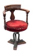 An Edwardian stained beech ship's swivel open armchair by A Blain & Son, Liverpool,