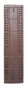 A 19th century sailor's work oak cribbage board: with stipple engraved flags to base, 32.