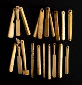 A collection of 19th century bone teethers: including a hammer, a saw and others.