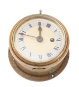 A brass bulkhead clock by Astral: with silvered chapter ring and Roman numerals,
