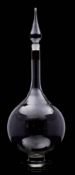 A large pharmacy window display carboy or decanter and stopper: of onion form with circular foot,
