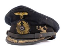 A WWII Kriegsmarine U-Boat Officers peaked cap: the black cloth cap with gilt embroidered badges,