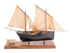 A scale model of the Mevagissey Lugger FY150 'Margaret' by D Proctor: fully rigged above open deck