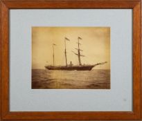 Two late 19th/ early 20th century photographs of HMS Surprise: one with white ensigns as an