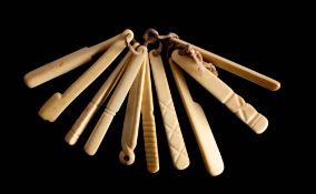 A set of ten 19th century bone teethers : including a pair of pliers, a cricket bat etc.