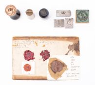 An Edwardian seal for 'The seal of His Majesty's Ships': together with a brass 'Admiralty Stores