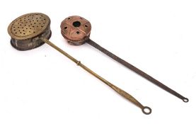 A 19th Century brass oval chestnut roaster:, the handle with ring terminal,