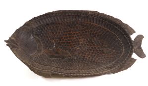 A carved wood dish: in the shape of a carp, 67 x 34cm.