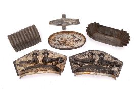 A tin two-section pie mould: decorated with two birds and a collection of pastry cutters, etc.