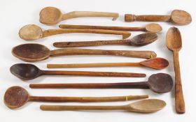 A collection of twelve treen cooking spoons: of various designs.