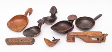 A Continental carved wood and iron and brass studded slicer:, 26cm long, a carved wood tinder box,
