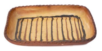 A Slipware decorated rectangular dish: with combed vertical lines, 33 x 22cm.